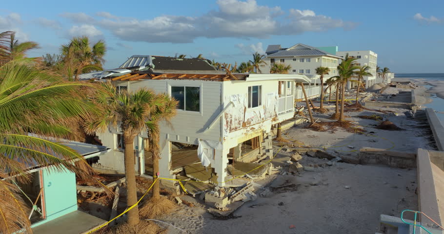 Destroyed houses on ocean shore after hurricane Milton landfall. Natural disaster consequences on Manasota Key, Florida. Storm surge severe damage.