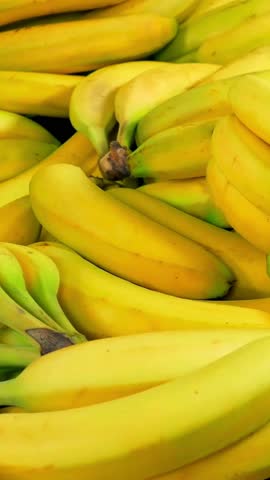 Bunch of bananas, healthy organic fruit. Diet food. Fresh bananas lying in fruit market. Healthy food concept. Bananas harvesting concept. Farm produce	