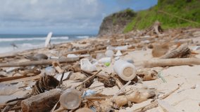 Plastic debris litters a beach, highlighting the alarming extent of environmental pollution. The beauty of the coastline contrasts sharply with the waste, urging immediate ecological attention. - Powered by Shutterstock - Get 15% off with code: PIKWIZARD15