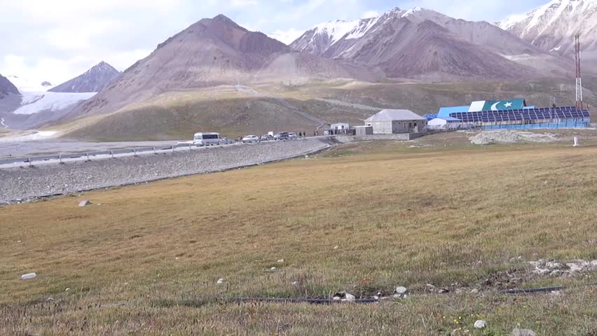The view from the China-Pakistan border offers stunning landscapes, with towering snow-capped peaks, rugged terrain, and vast valleys, showcasing the grandeur of the Karakoram range.