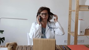 mature woman doctor, in her hospital consultation - Powered by Shutterstock - Get 15% off with code: PIKWIZARD15