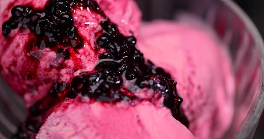 ice cream with ripe raspberries and blackberries, delicious ice cream with sugar and raspberry-blackberry flavor with raspberry and blackberry berry jam