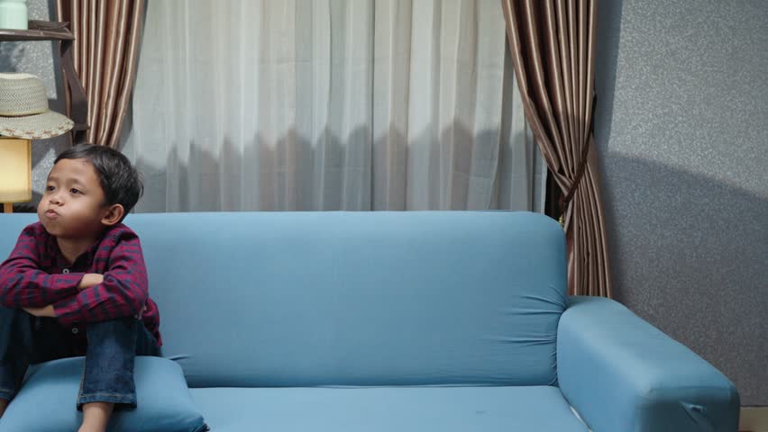 Little boy gets a surprise gift containing a beautiful pet fish inside from his older brother. A pleasant surprise that brings warmth to the house. Pet fish, gifts, surprises, family, joy