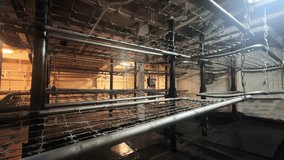 Vintage old military ship industrial dormitory featuring multiple stacked chain-link beds supported by metal frames - Powered by Shutterstock - Get 15% off with code: PIKWIZARD15