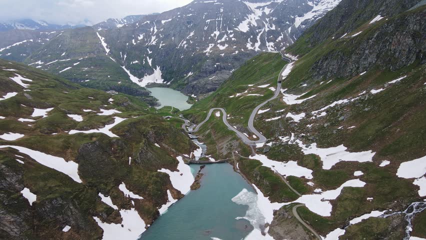 Drone view of Grossglockner High Alpine Road, winding near Naßfeld Speicher Lake