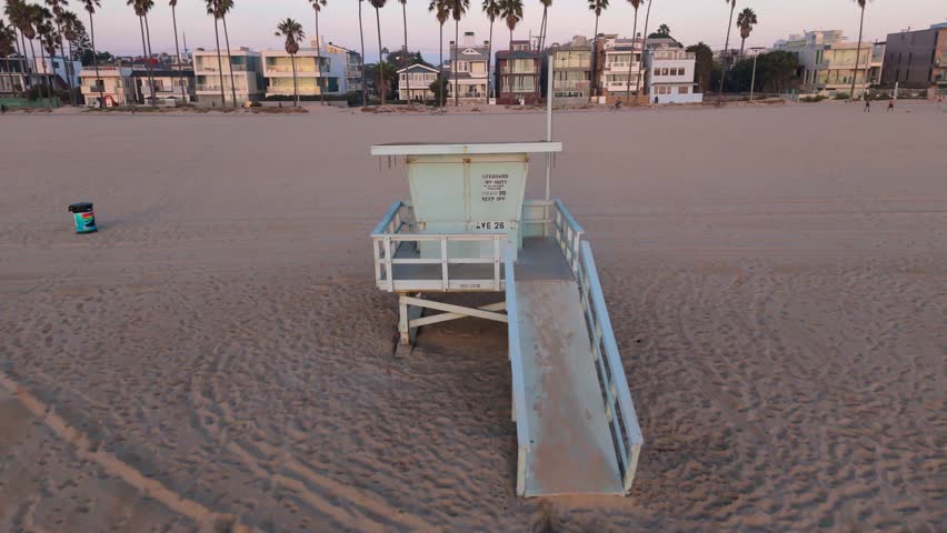 A Lonely Lifeguard Station Standing Alone at Sunset on the Beautiful Beach Shoreline