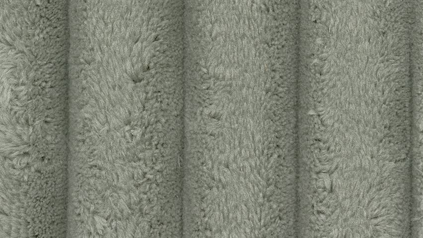 Macro Shot of Ribbed Dark Green Furry Material with Slow Camera Pan