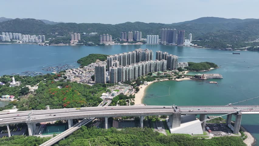 Explore Hong Kong Ma Wan Park Island between Tsing Yi and Lantau featuring rustic fishing villages beachside nature garden residences and Noahs Ark themed attraction