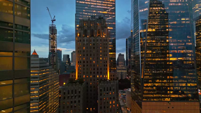New York City Skyline at dusk night aerial view. Skyscrapers NYC near dramatic night clouds. New York City skyline, cityscape of Manhattan in USA. Panoramic view on Manhattan at night.