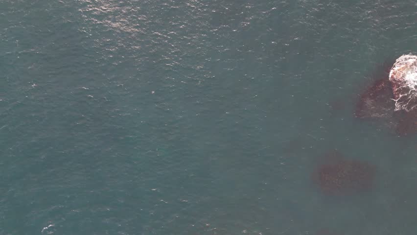 Waves of water splashing on the Duncasby head stacks