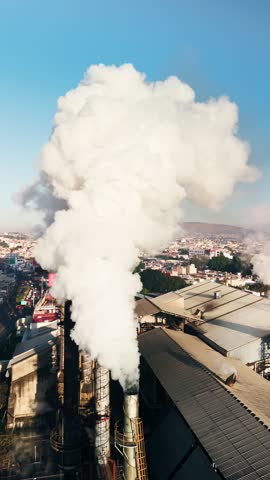 Toxic smoke cloud coming out of the pipes of industrial plant. Mexico