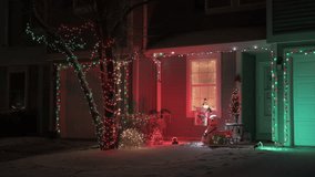 Establishing shot of luxury house with nice Christmas decoration at winter time at night  - Powered by Shutterstock - Get 15% off with code: PIKWIZARD15