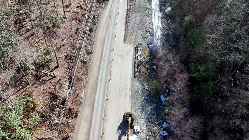 road repair from hurricane helene flooding near mountain city tennessee