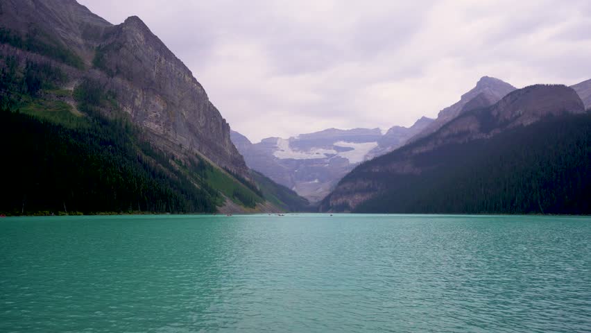 Peaceful Lake Louise in Banff, Canada with Turquoise Waters and a View of a Distant Glacier