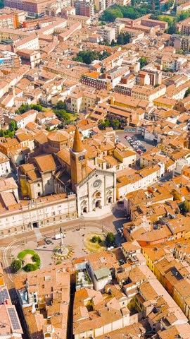 Vertical video. Piacenza, Italy. Cathedral of Piacenza. Episcopal Palace. Historical city center. Summer day, Aerial View. Rich colors