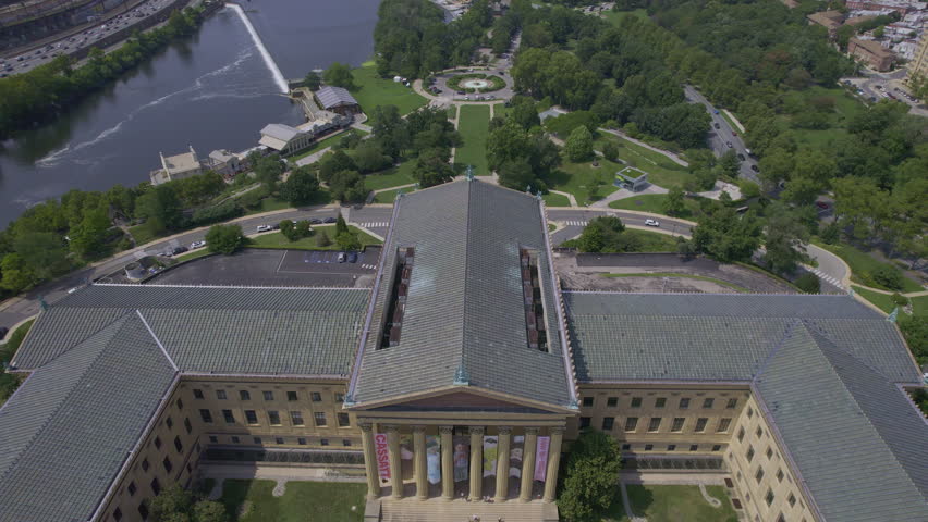 Sweeping aerial panorama revealing philadelphia museum of art, surrounding eakins oval, and winding schuylkill river under bright summer sunlight. Philladelphia, USA