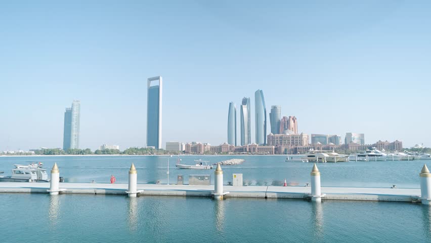 Abu Dhabi Skyline in Daylight  with sea view and skyscrapers 