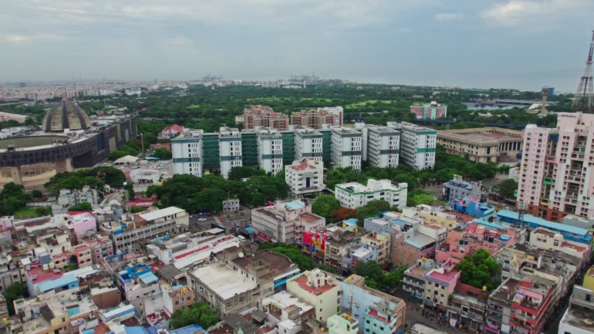 Government medical college and hospital in madras with crowded residentials buildings in anna salai, triplicane, chennai, tamil nadu day time push back drone shot