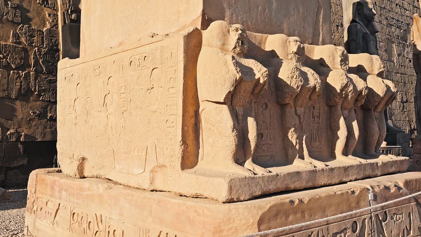 tilt up 4k footage of Obelisk at the Luxor Temple in Egypt. Look of carved hieroglyphs. Big stone ancient obelisk in Egypt