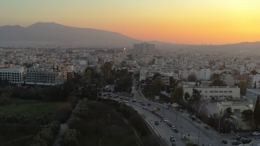Drone shot of Marousi in Athens, Greece with traffic at sunset