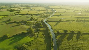 An Aerial view of sunset over the Cheshire rural landscape with green fields - Powered by Shutterstock - Get 15% off with code: PIKWIZARD15