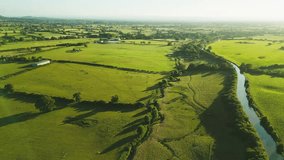 An Aerial view of sunset over the Cheshire rural landscape with green fields - Powered by Shutterstock - Get 15% off with code: PIKWIZARD15