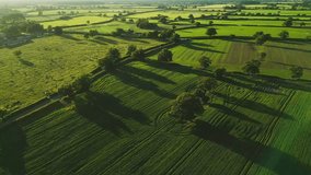 An Aerial view of sunset over the Cheshire rural landscape with green fields - Powered by Shutterstock - Get 15% off with code: PIKWIZARD15