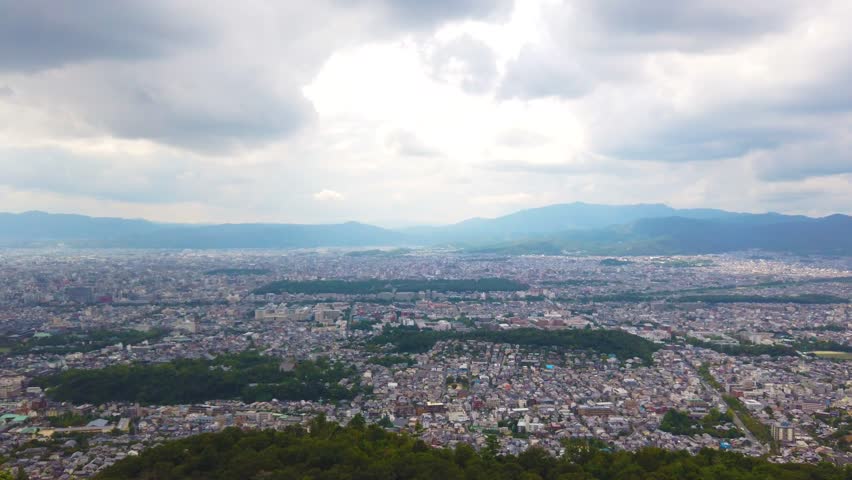 Aerial view of Kyoto City at daylight with mountain natural background, Japan