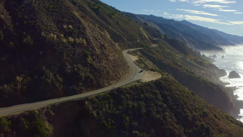 Aerial view of Pacific Ocean coastline along Highway 1 in California. Big Sur, Bixby Bridge, Lucia. Travel concept, tourism, travel, vacation. 4K video.