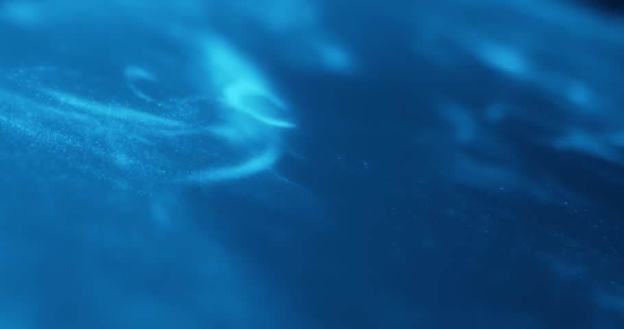 Blue abstract particle effect with flowing motion, resembling underwater or cosmic scenes. Ideal for video loops, technology, sci-fi, relaxation, and motion graphics. 3D render