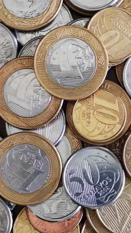 Brazilian real coins rotating close up