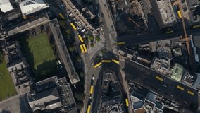 Awesome and stunning Aerial view of Public transport in Dublin city with clear and open roads and  Pollution free environment. Buses and tram driving on. Tilt up reveal of cityscape, Dublin, Ireland,  - Powered by Shutterstock - Get 15% off with code: PIKWIZARD15