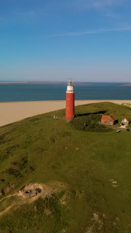 Surrounded by rolling dunes and soft sands, the Texel lighthouse stands proudly over the North Sea. This captivating landmark invites exploration and captures the hearts of visitors Netherlands