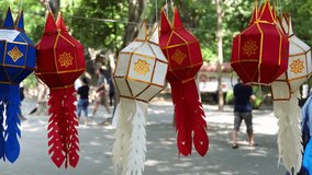 Traditional lanterns made of paper and cotton hang around the temple, representing ancient decorative styles in northern Thailand. - Powered by Shutterstock - Get 15% off with code: PIKWIZARD15