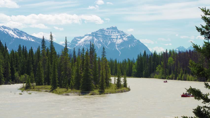 Athabasca River Rafting in summer. Jasper National Park, Alberta, Canada. Canadian Rockies. Mount Kerkeslin in the background.