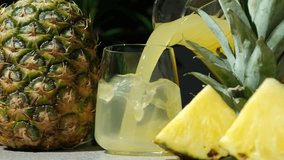 Pineapple juice pour into a glass, slow motion - Powered by Shutterstock - Get 15% off with code: PIKWIZARD15