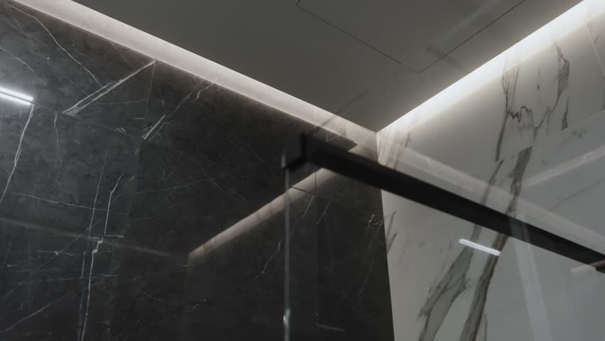 An Elegant Bathroom Shower Design that Showcases Beautiful Marble Accents for Style