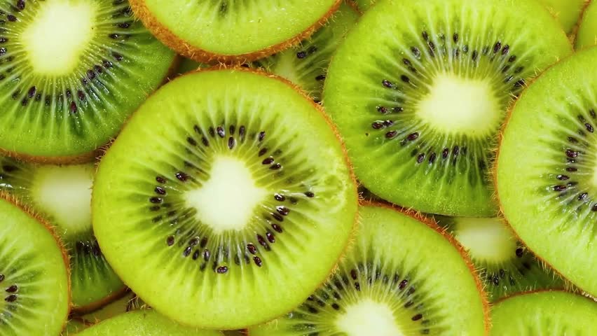 Macro Shot of Rotating Kiwi Fruit Slices. A Perfect Snack for a Refreshing Break.