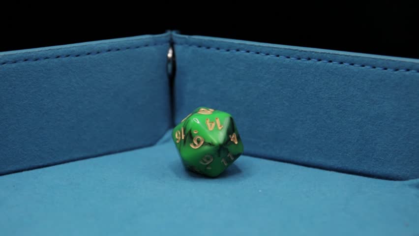 D20 green dice rolled, high quality slowmotion video