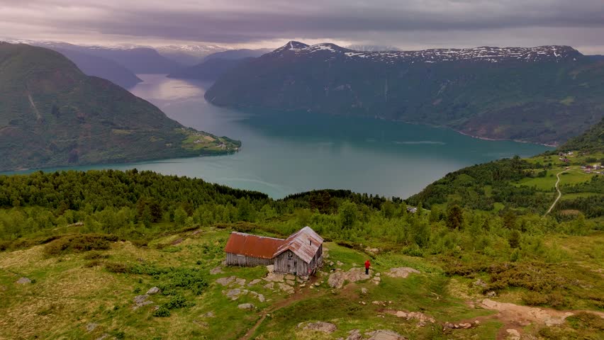 Experience breathtaking vistas of Norways stunning fjords as the tranquility of a hillside cabin offers a perfect retreat. Natures beauty unfolds with every glance. LustraFjord Molden Hike Norway
