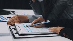 Two business leaders talk about charts, financial graphs showing results are analyzing and calculating planning strategies, business success building processes. - Powered by Shutterstock - Get 15% off with code: PIKWIZARD15