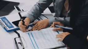 Two business leaders talk about charts, financial graphs showing results are analyzing and calculating planning strategies, business success building processes. - Powered by Shutterstock - Get 15% off with code: PIKWIZARD15