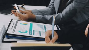 Two business leaders talk about charts, financial graphs showing results are analyzing and calculating planning strategies, business success building processes. - Powered by Shutterstock - Get 15% off with code: PIKWIZARD15