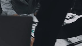 Two business leaders talk about charts, financial graphs showing results are analyzing and calculating planning strategies, business success building processes. - Powered by Shutterstock - Get 15% off with code: PIKWIZARD15