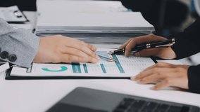 Two business leaders talk about charts, financial graphs showing results are analyzing and calculating planning strategies, business success building processes. - Powered by Shutterstock - Get 15% off with code: PIKWIZARD15