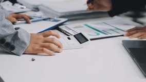 Two business leaders talk about charts, financial graphs showing results are analyzing and calculating planning strategies, business success building processes. - Powered by Shutterstock - Get 15% off with code: PIKWIZARD15