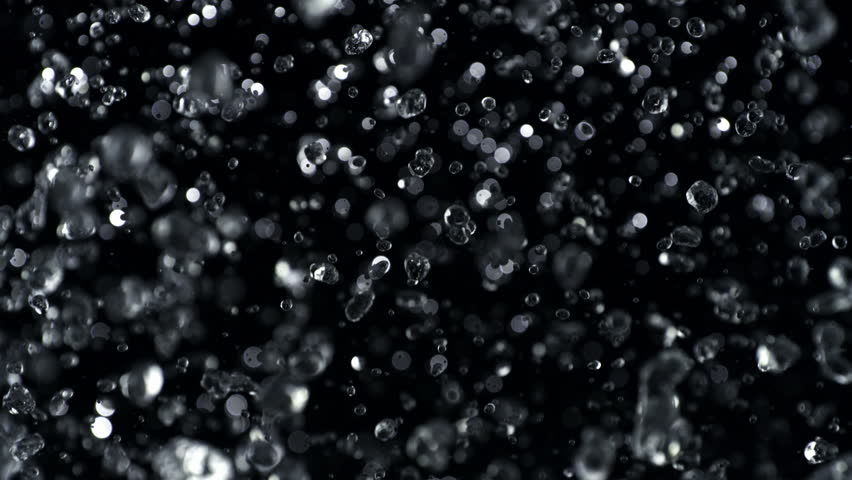 Super Slow Motion Shot of Falling Water Drops Isolated on Black Background, 1000fps.