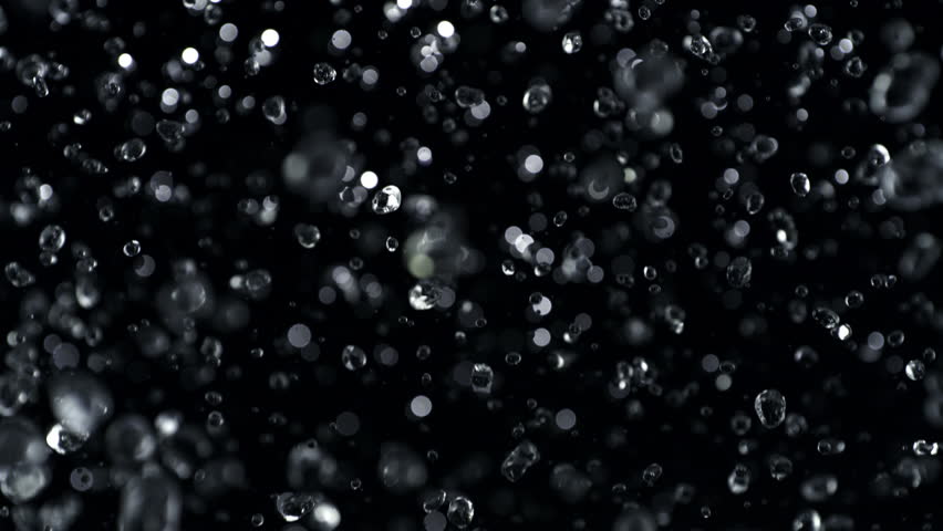 Super Slow Motion Shot of Falling Water Drops Isolated on Black Background, 1000fps.