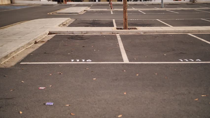 White parking space lines and numbers on asphalt surface, suitable for parking management presentations, urban planning materials, facility documentation and traffic organization guides