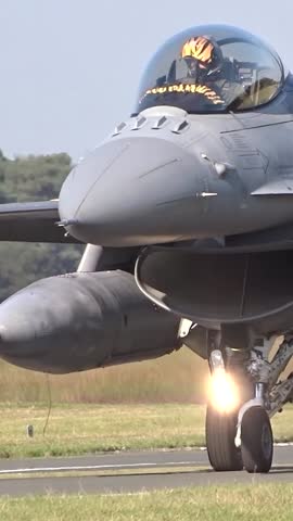 air force fighter jet taxiing to runway for combat operations aircraft action military airbase close up view ready war mission heat haze base aviation tactical defense maneuvers